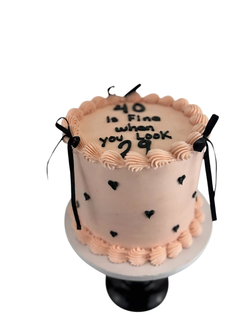 VINTAGE ROUND CAKE WITH SMALL BLACK HEARTS